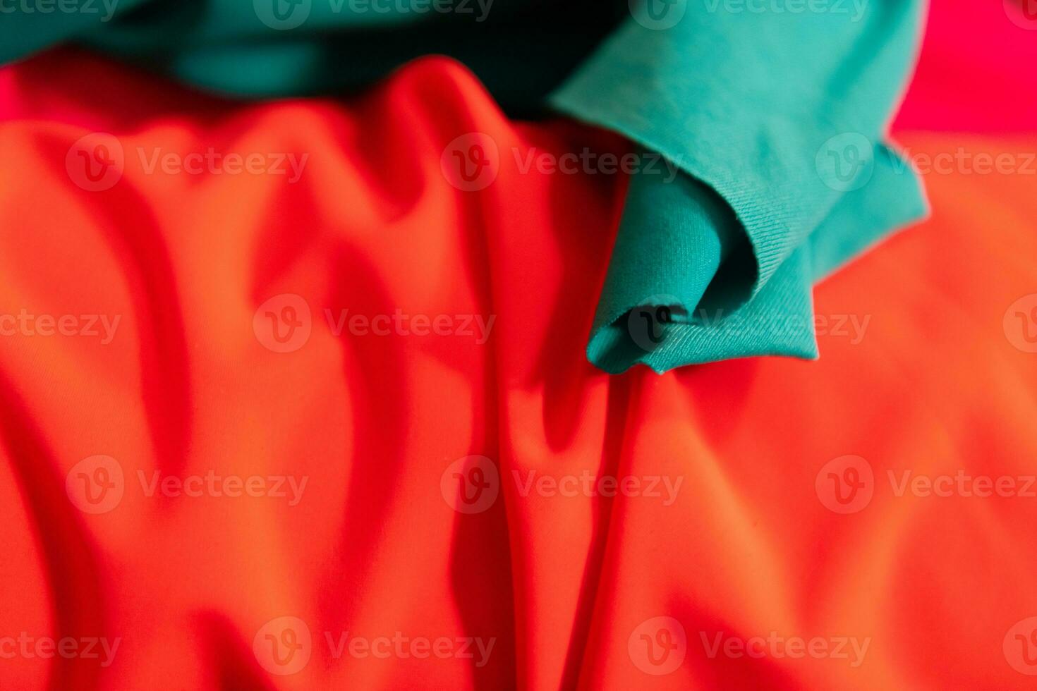 Collection of fashionable fabrics. Samples of different natural fabrics for sewing a fashion collection of clothes. Large selection of fabrics in the store or tailor warehouse. photo