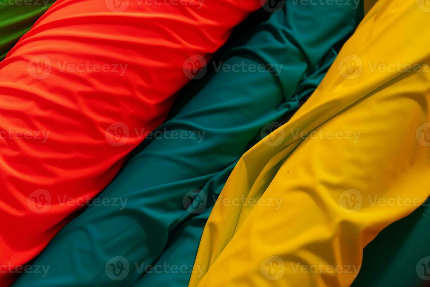 Collection of fashionable fabrics. Samples of different natural fabrics for sewing a fashion collection of clothes. Large selection of fabrics in the store or tailor warehouse. photo