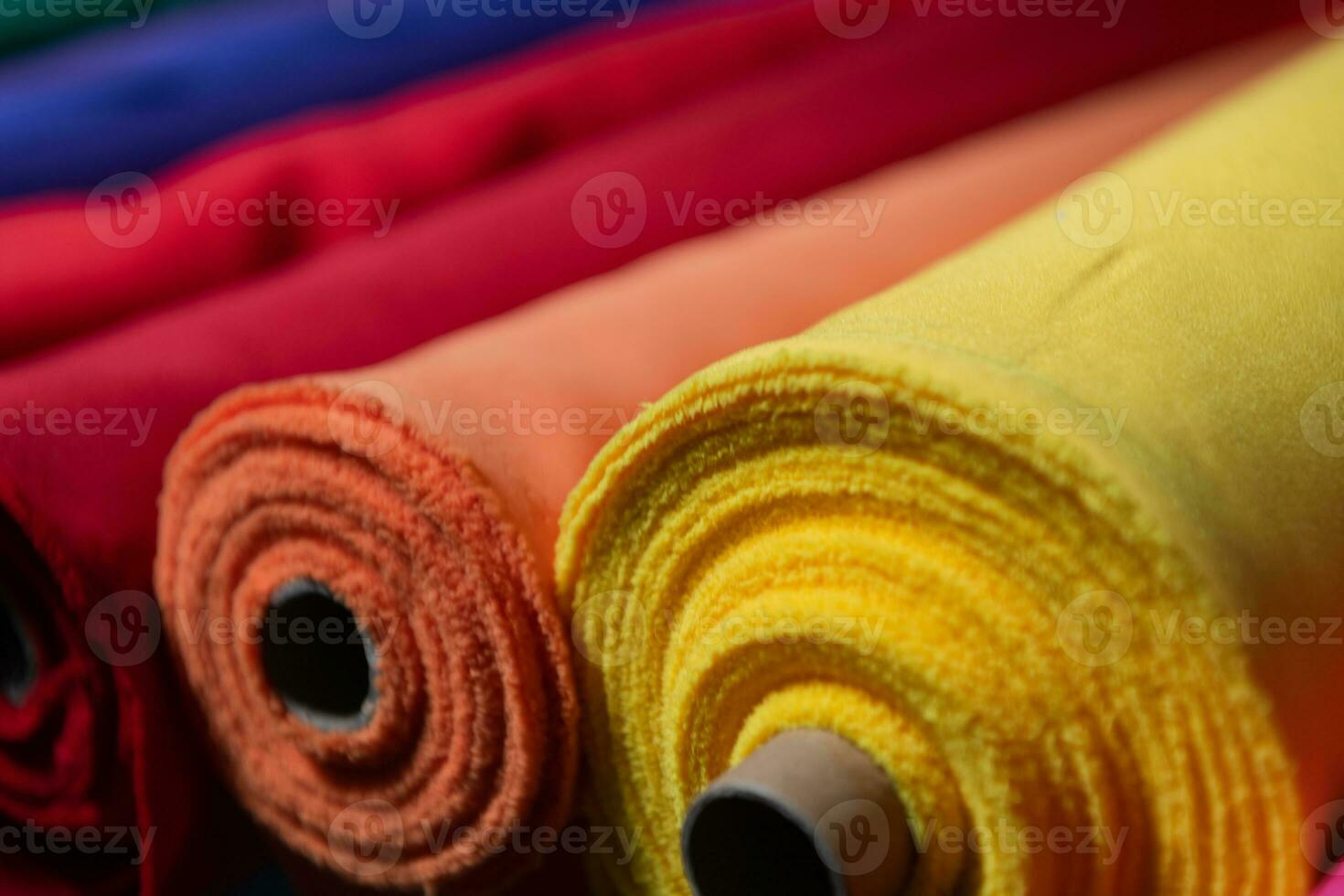 Interior of an industrial warehouse with fabric rolls samples. Small business textile colorful warehouse. photo