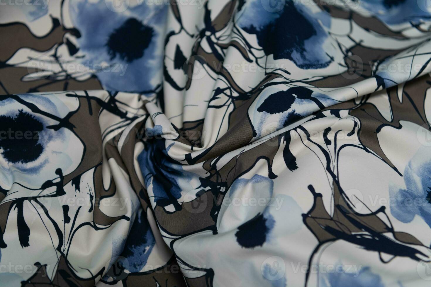 Collection of fashionable fabrics. Samples of different natural fabrics for sewing a fashion collection of clothes. Large selection of fabrics in the store or tailor warehouse. photo