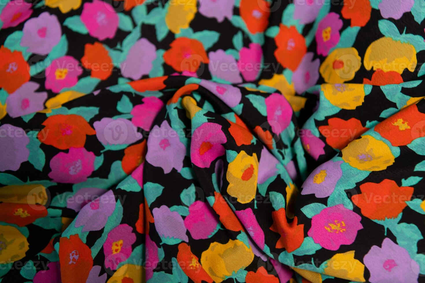 Collection of fashionable fabrics. Samples of different natural fabrics for sewing a fashion collection of clothes. Large selection of fabrics in the store or tailor warehouse. photo