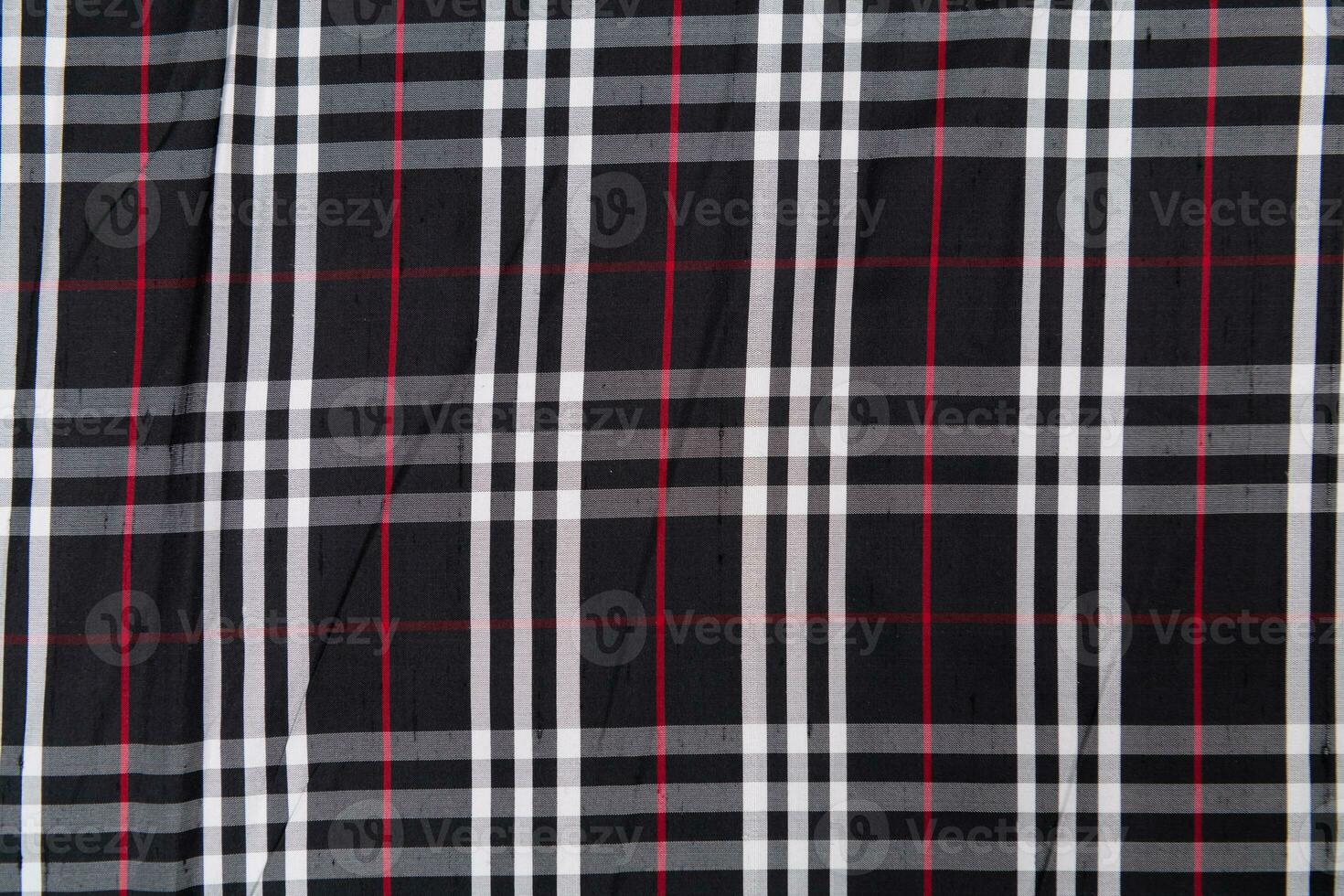 Collection of Scottish fashionable fabrics . Samples of different natural fabrics for sewing a fashion collection of clothes. Large selection of fabrics in the store or tailor warehouse. photo