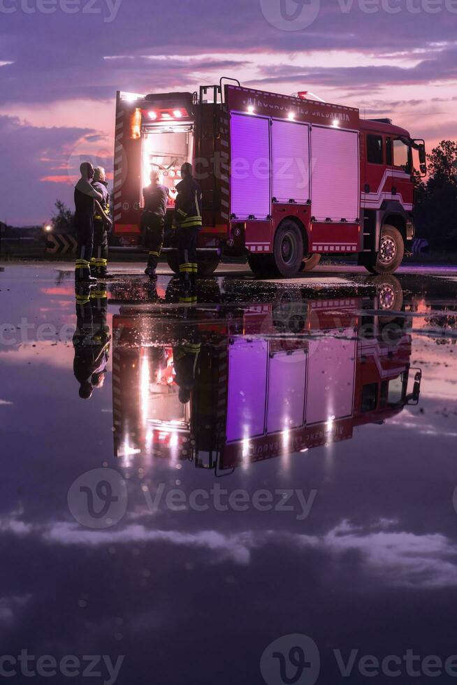 Fire truck emergency vehicle. Firefighting apparatus and water to save lives, suppress wildfire, extinguish building fires and assist vehicle collisions or traffic car crash accidents. photo