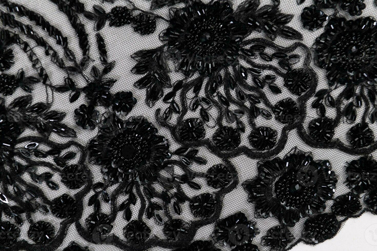 Collection of fashionable fabrics. Samples of different natural fabrics for sewing a fashion collection of clothes. Large selection of fabrics in the store or tailor warehouse. photo