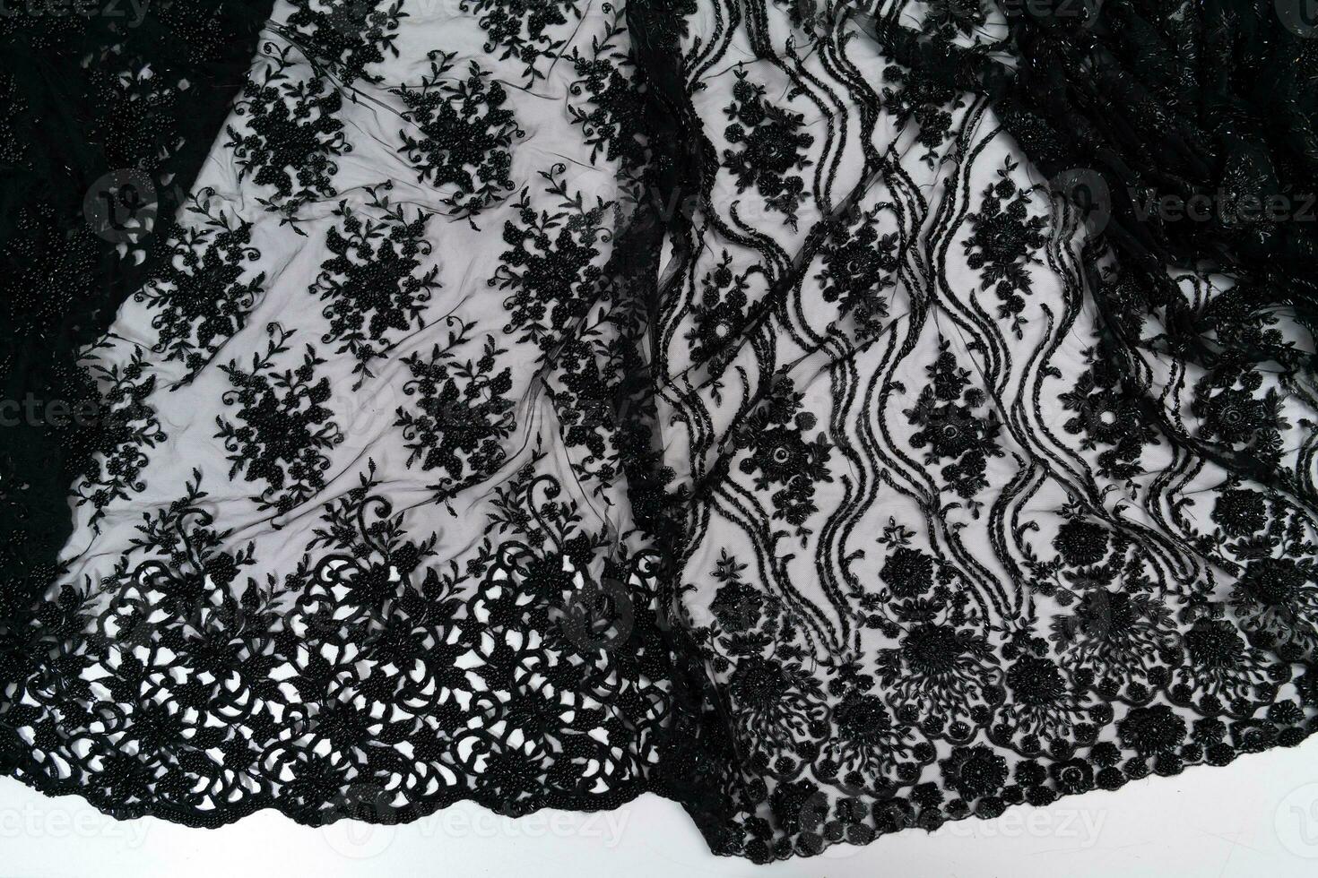 Collection of fashionable fabrics. Samples of different natural fabrics for sewing a fashion collection of clothes. Large selection of fabrics in the store or tailor warehouse. photo