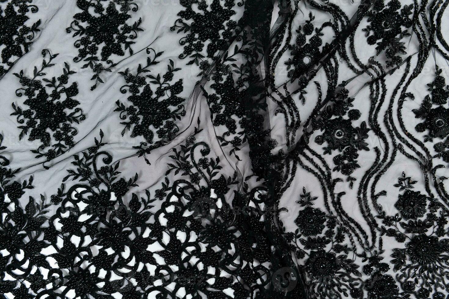 Collection of fashionable fabrics. Samples of different natural fabrics for sewing a fashion collection of clothes. Large selection of fabrics in the store or tailor warehouse. photo