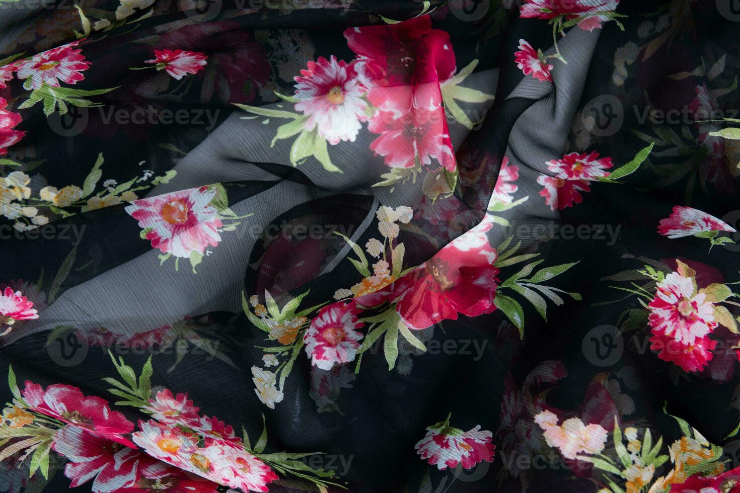 Collection of fashionable fabrics. Samples of different natural fabrics for sewing a fashion collection of clothes. Large selection of fabrics in the store or tailor warehouse. photo