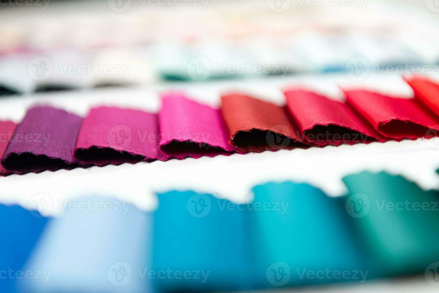 Tailor's workplace, thread spools and fabric samples in the atelier. Small business owners concept photo