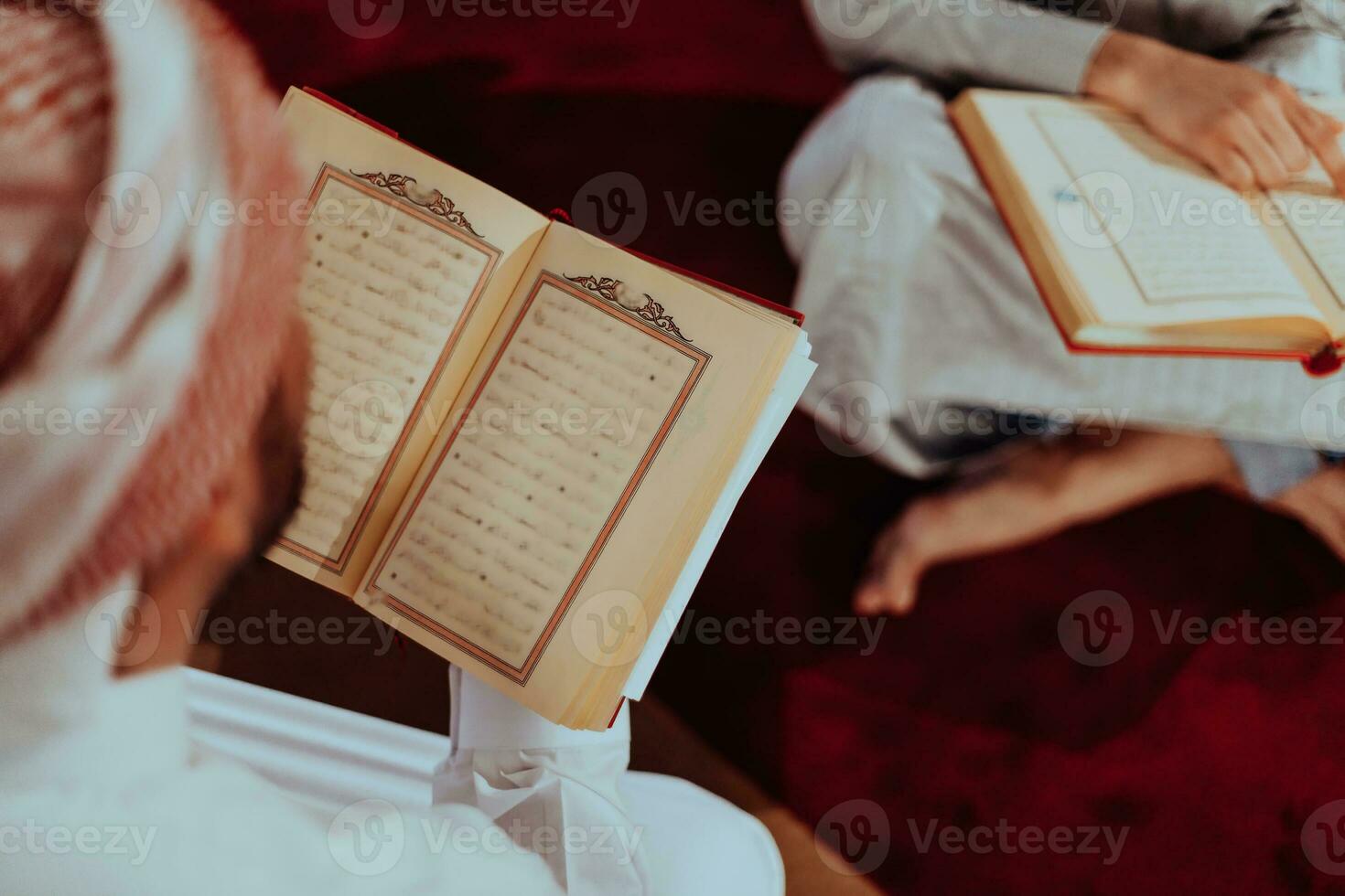 A group of Muslims reading the holy book of the Quran in a modern mosque during the Muslim holiday of Ramadan photo