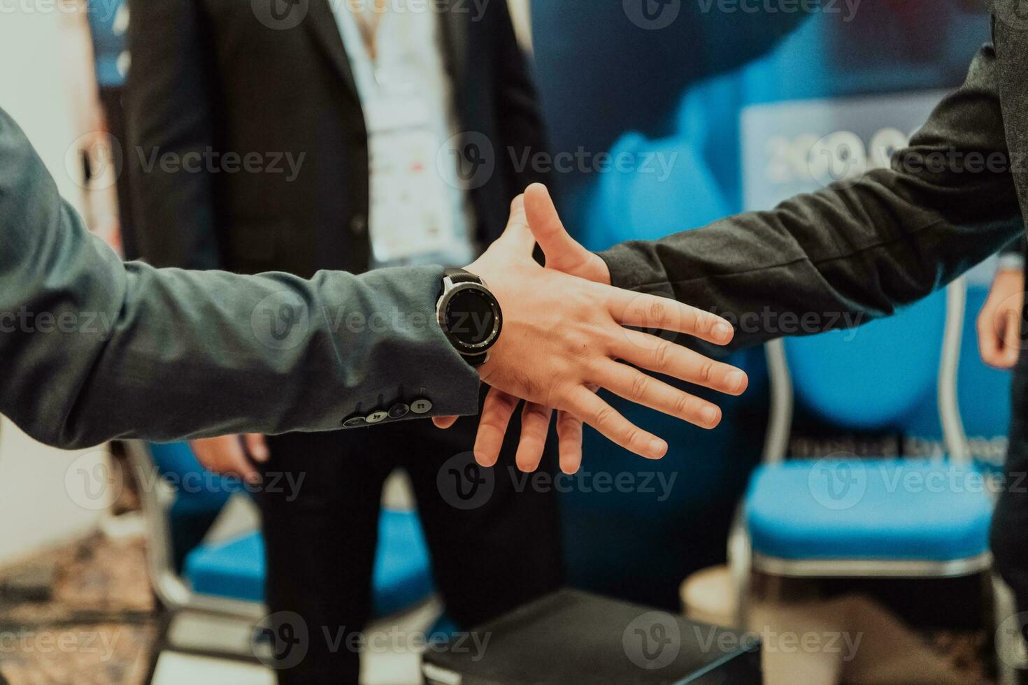 Close up a handshake, businessman together creates a mutually beneficial business relationship. The economic graph on the table photo