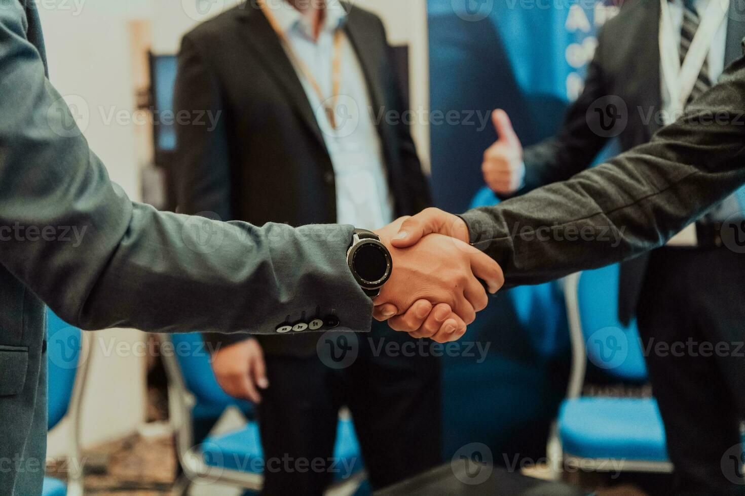 Close up a handshake, businessman together creates a mutually beneficial business relationship. The economic graph on the table photo