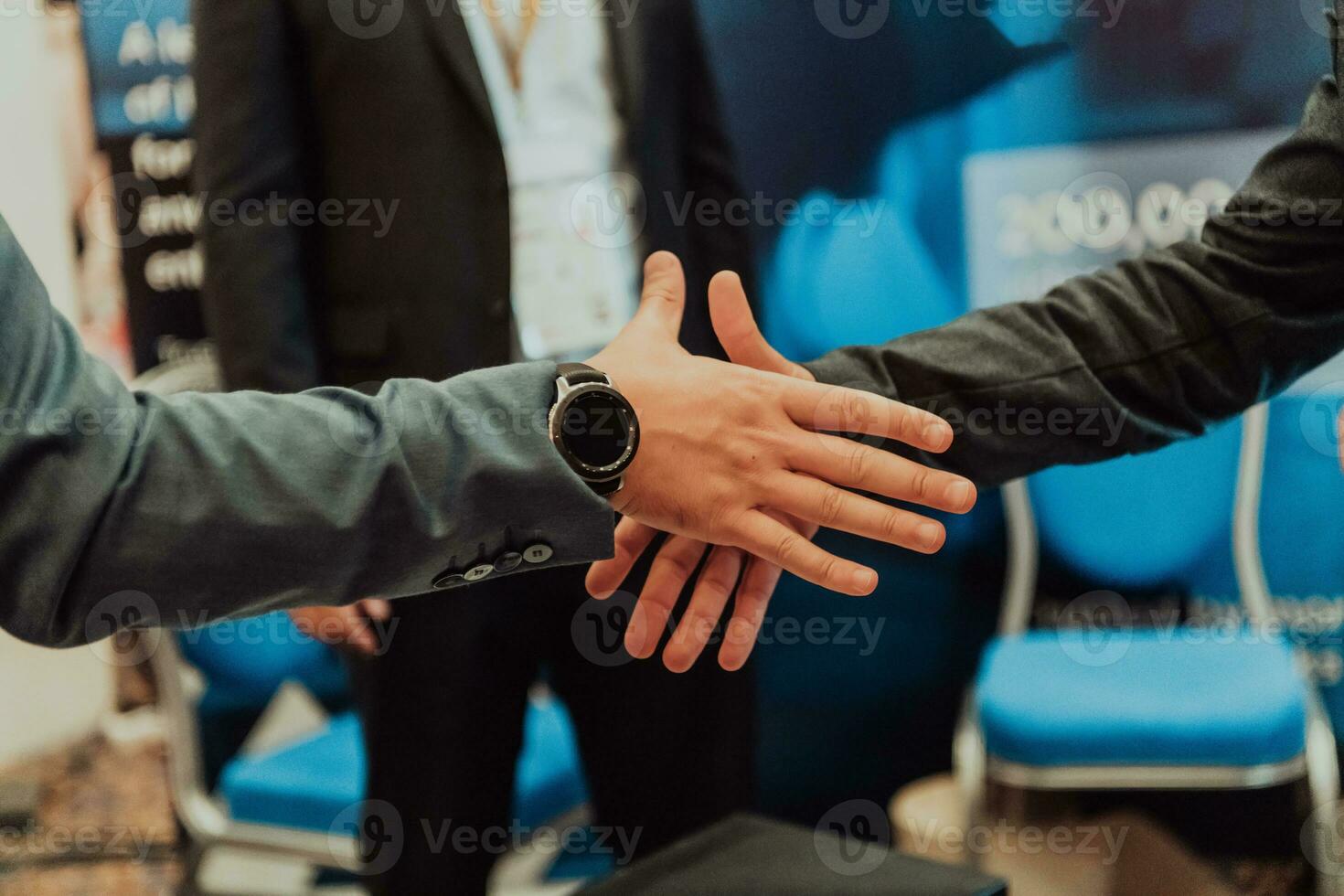 Close up a handshake, businessman together creates a mutually beneficial business relationship. The economic graph on the table photo