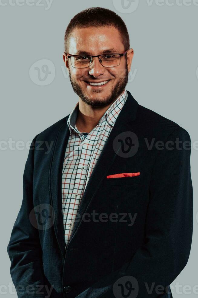 Portrait of businessman with glasses in black suit isolated on white background photo