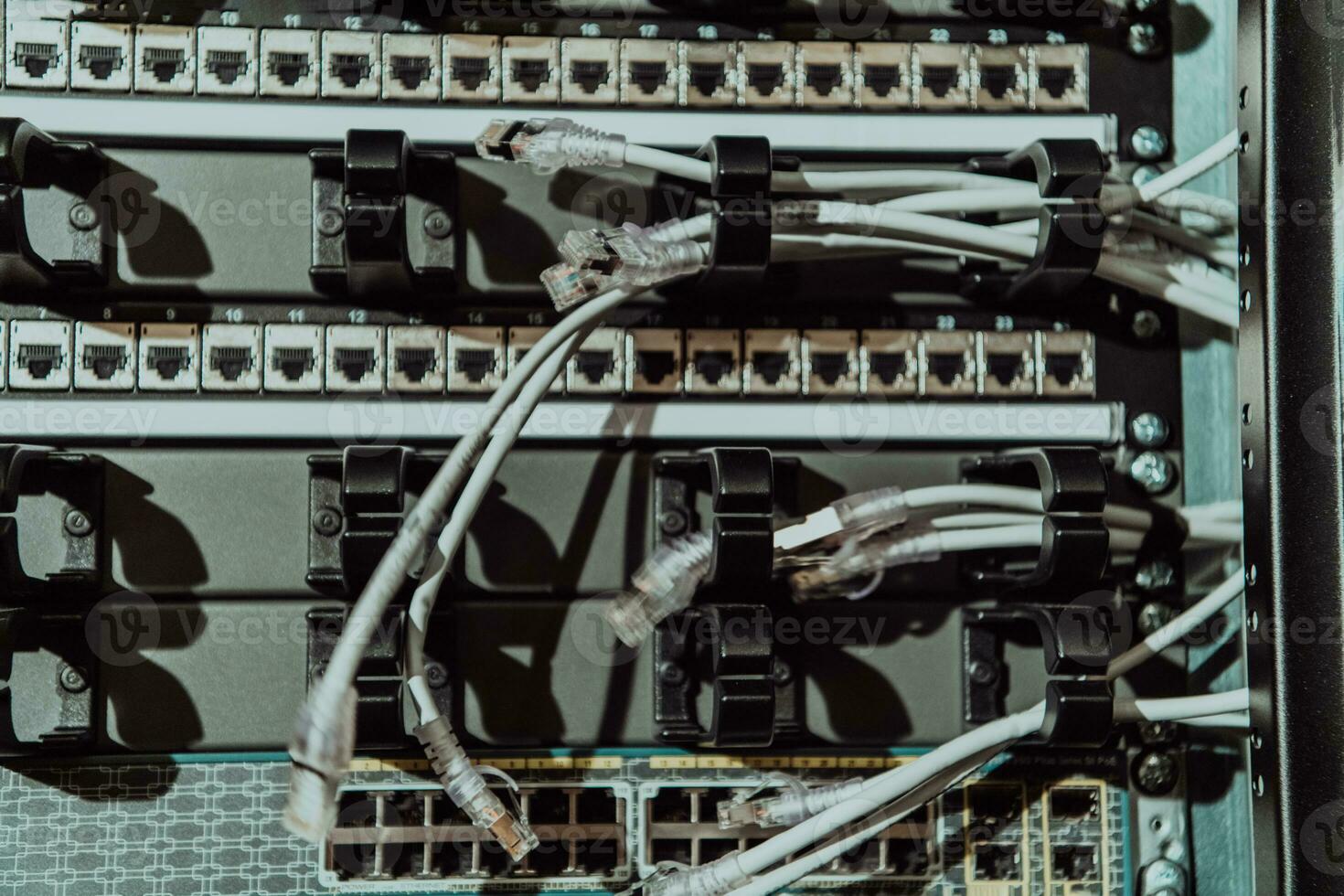Close up of technician setting up network in server room photo