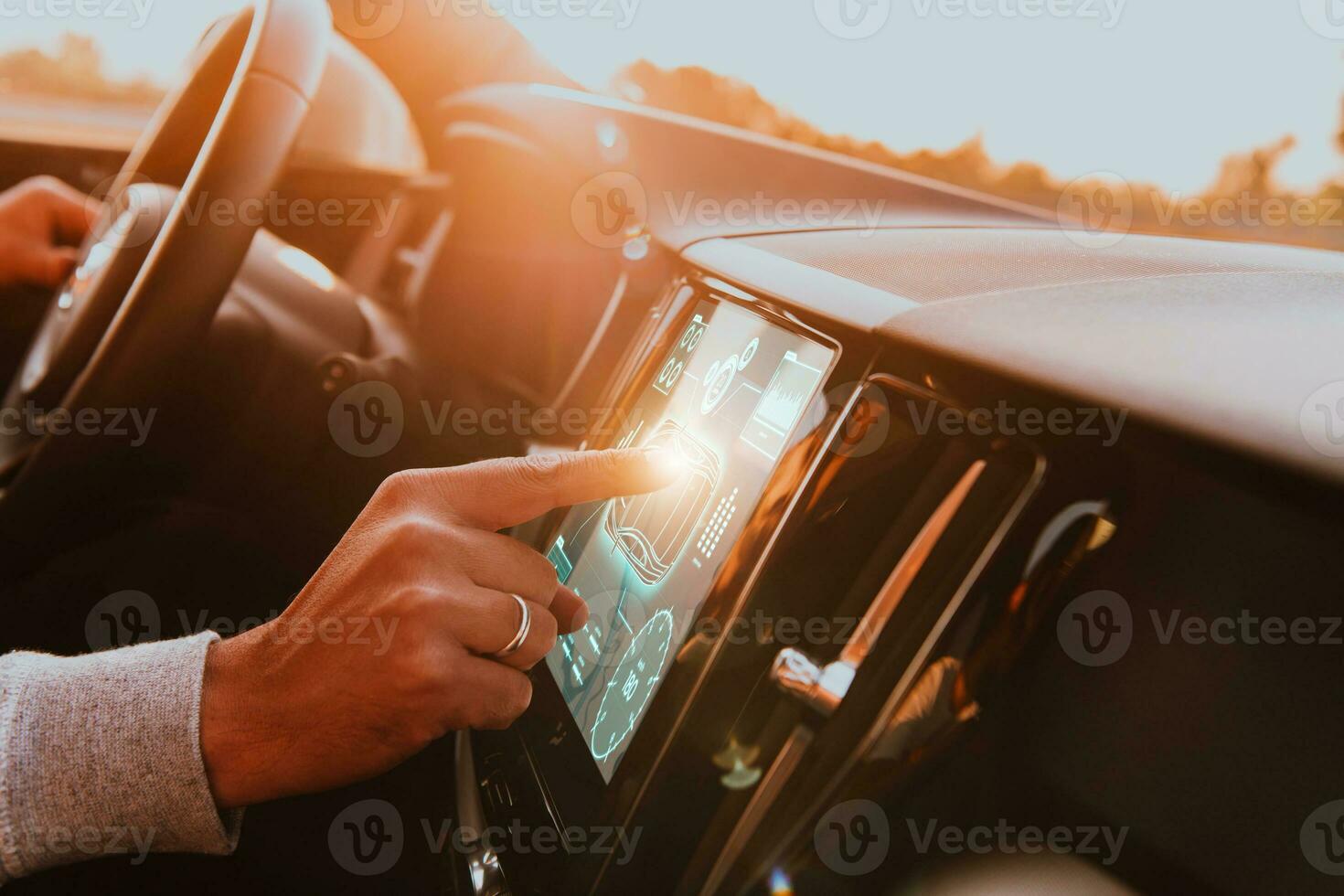 Close-up of a man's finger adjusting autopilot on the touch screen photo