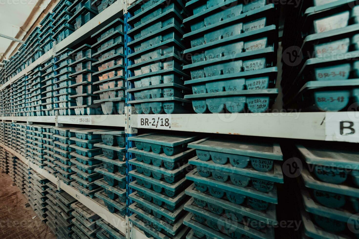 Gold mining storage rock core samples geology drilling industy. Large ore warehouse in modern industry, ores stacked in boxes. Selective focus photo