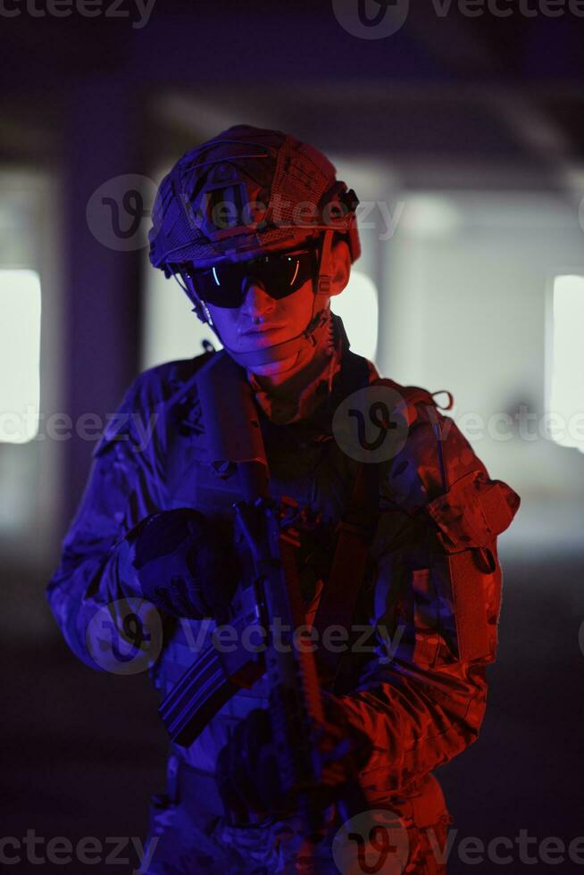 soldier squad team portrait in urban environment colored lightis photo