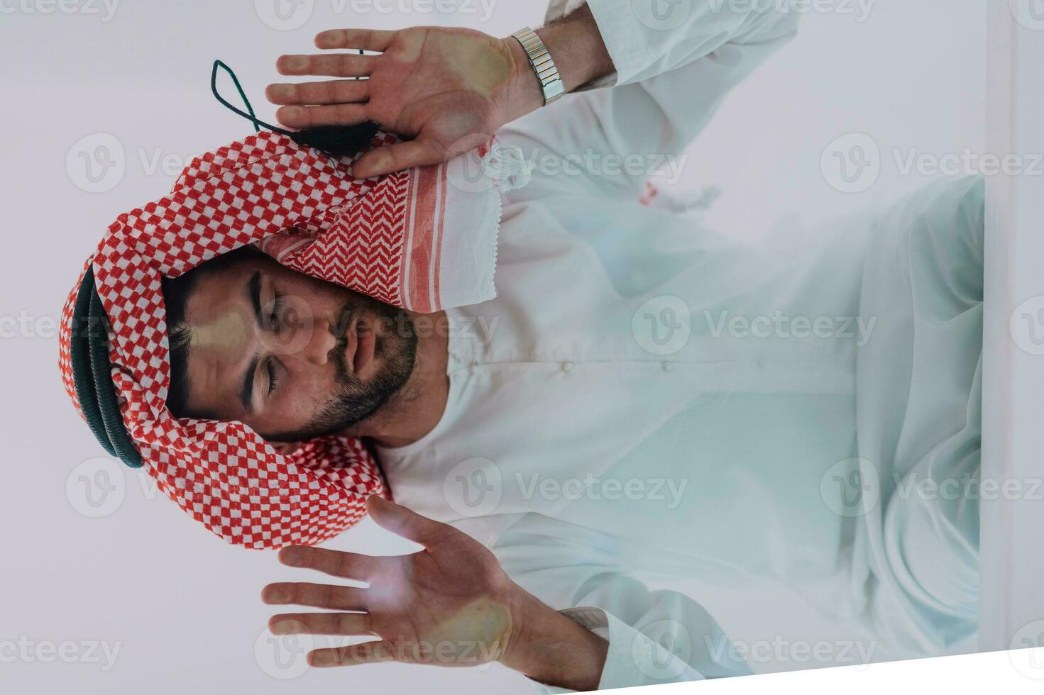 Muslim man doing sujud or sajdah on the glass floor photo