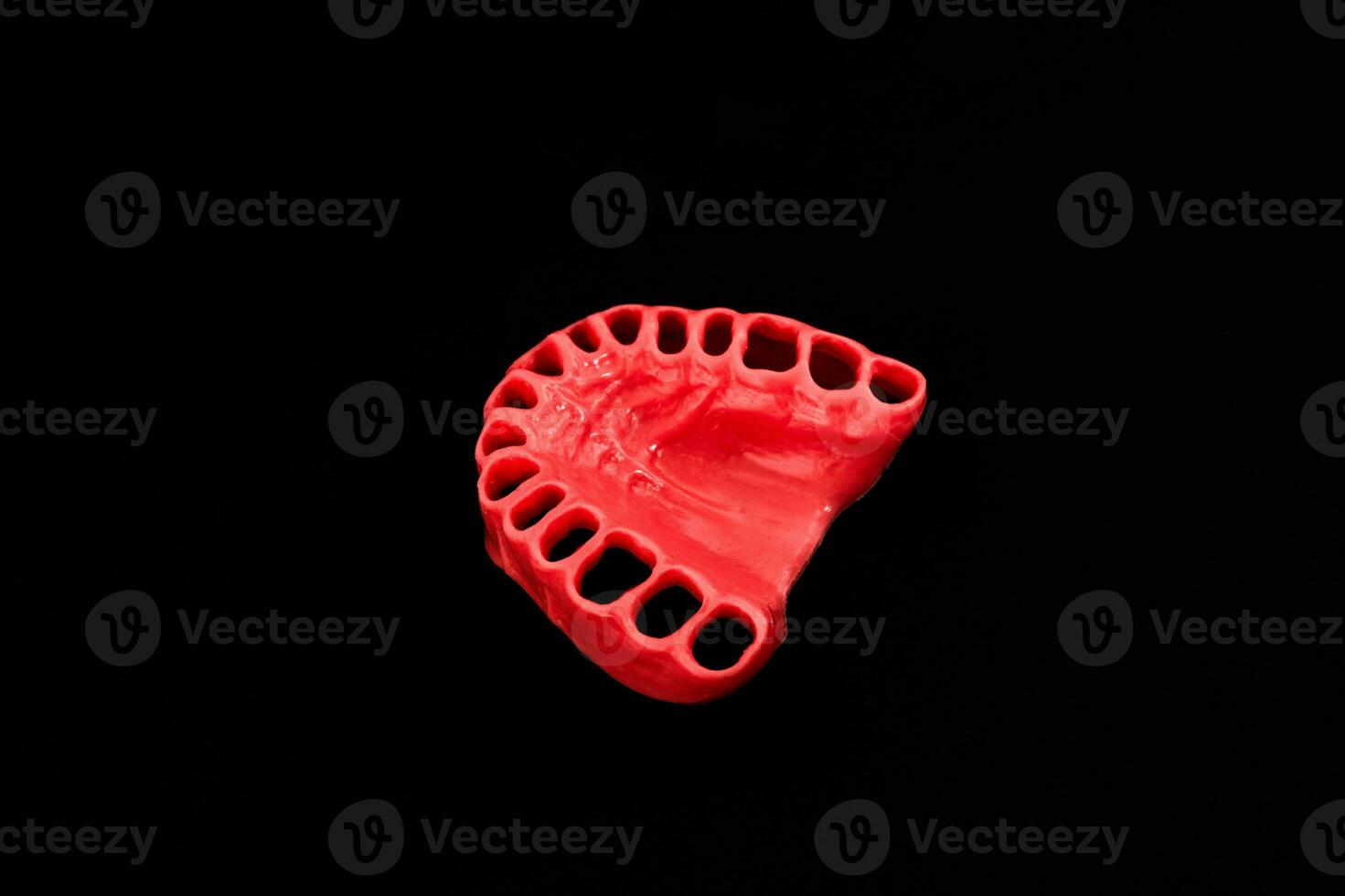 human gums without teeth model medical implant isolated on black background. Healthy teeth, dental care and orthodontic concept. photo