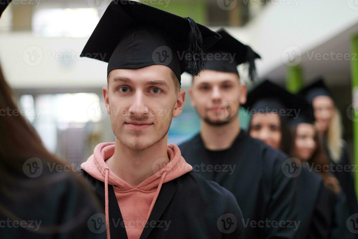 Group of diverse international graduating students celebrating photo