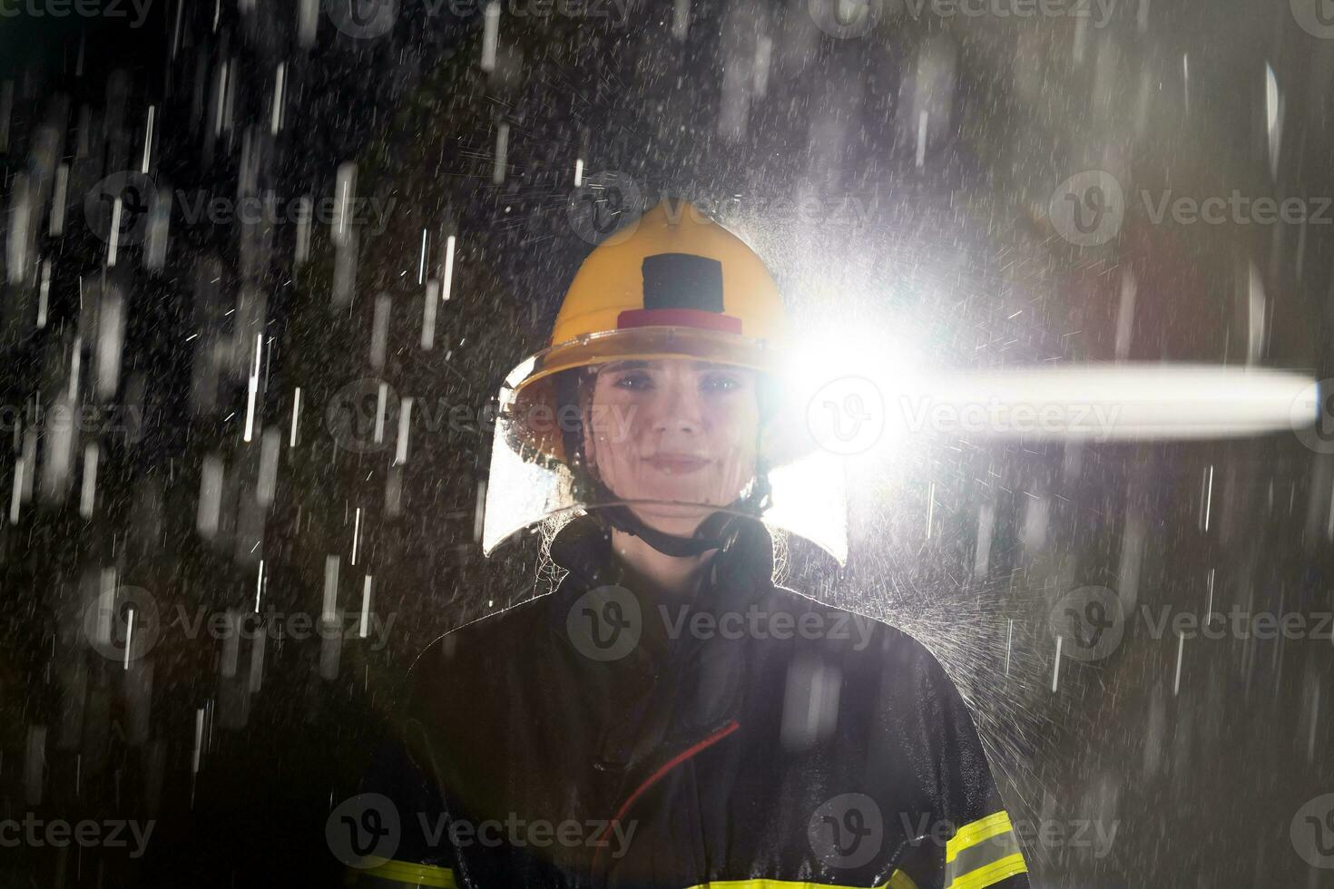 Portrait of a female firefighter standing and walking brave and optimistic. photo