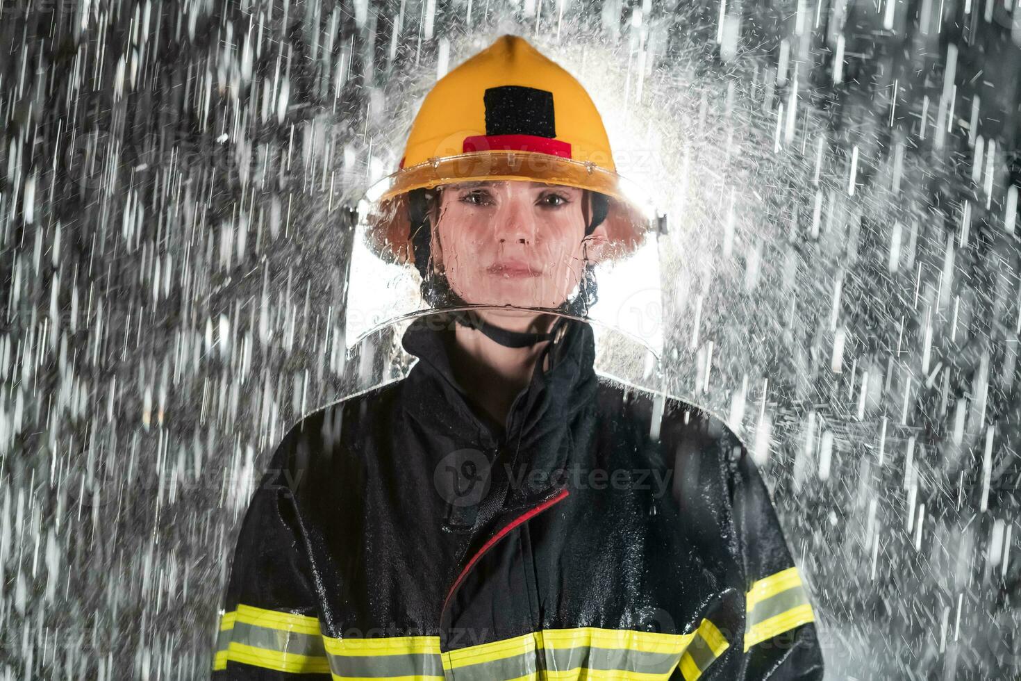 Portrait of a female firefighter standing and walking brave and optimistic. photo