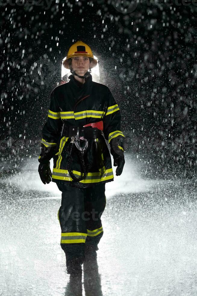 Portrait of a female firefighter standing and walking brave and optimistic. photo