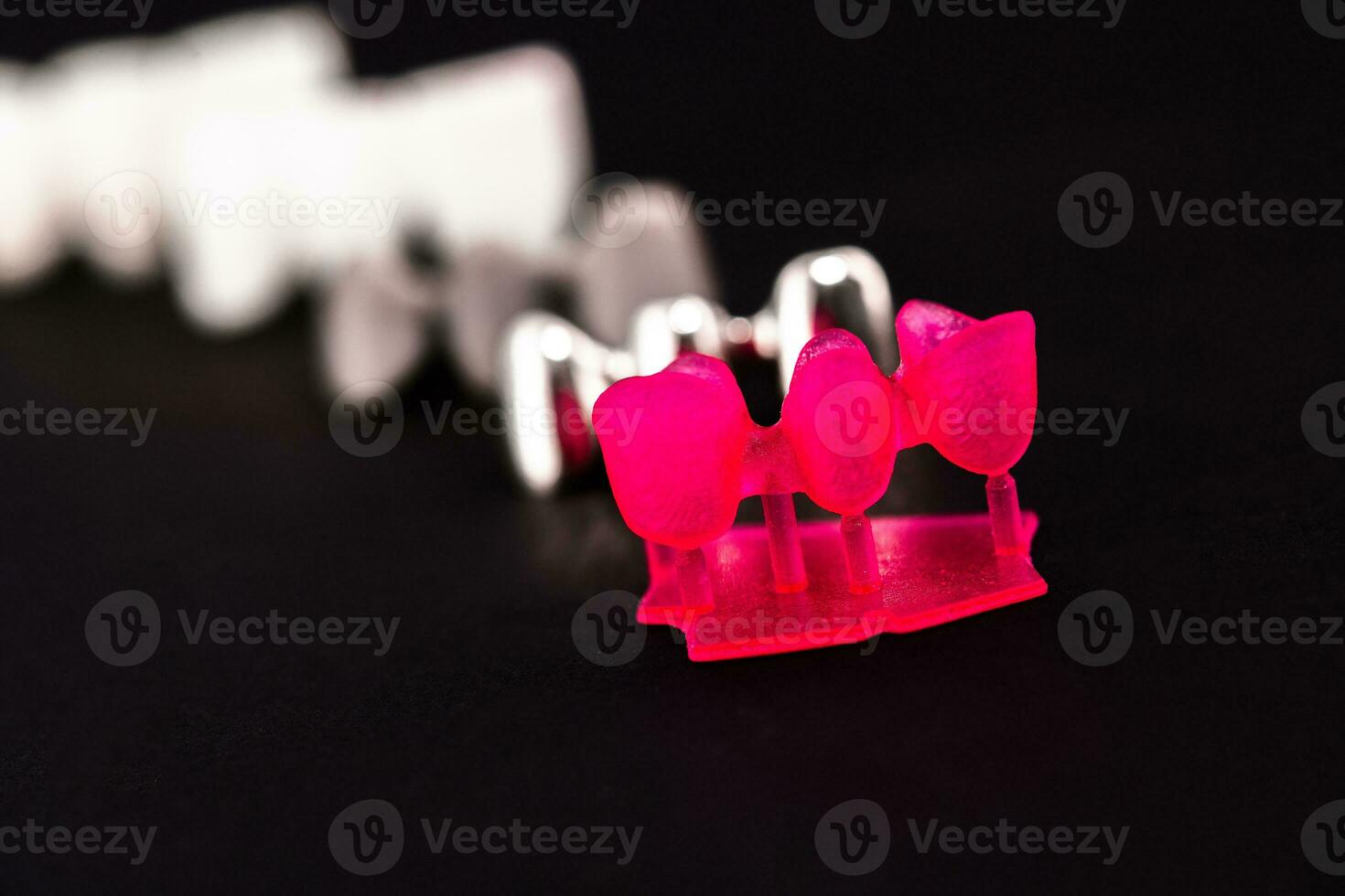 Teeth implant and crown installation process parts isolated on a black background. Medically accurate 3D model. photo