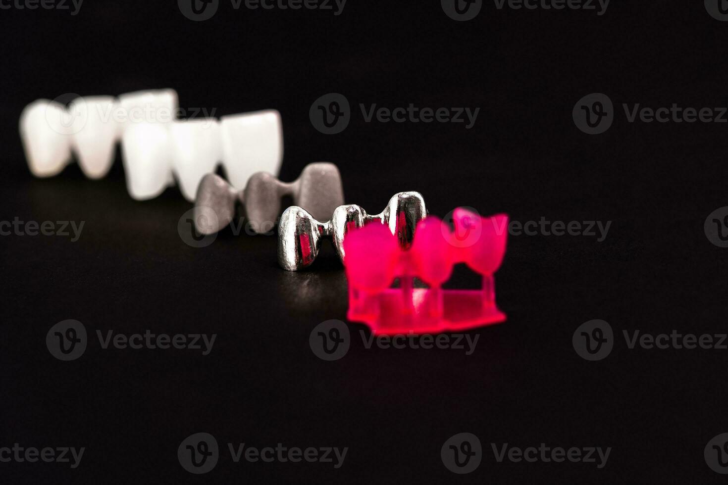 Teeth implant and crown installation process parts isolated on a black background. Medically accurate 3D model. photo