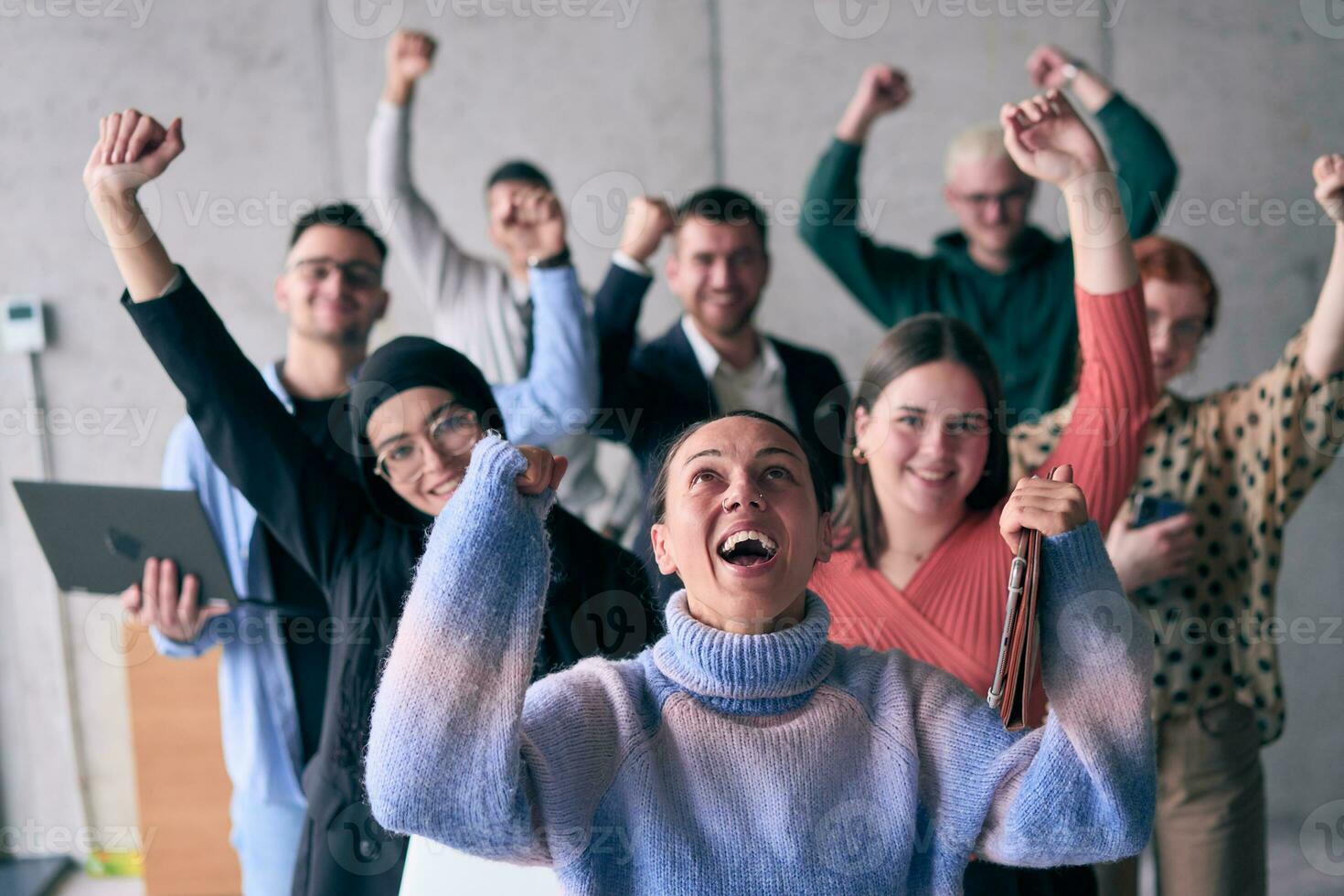 A diverse group of successful businessmen raises their hands in the air, symbolizing achievement, accomplishment, and the fulfillment of goals, exuding confidence, unity, and celebration of their collective success. photo
