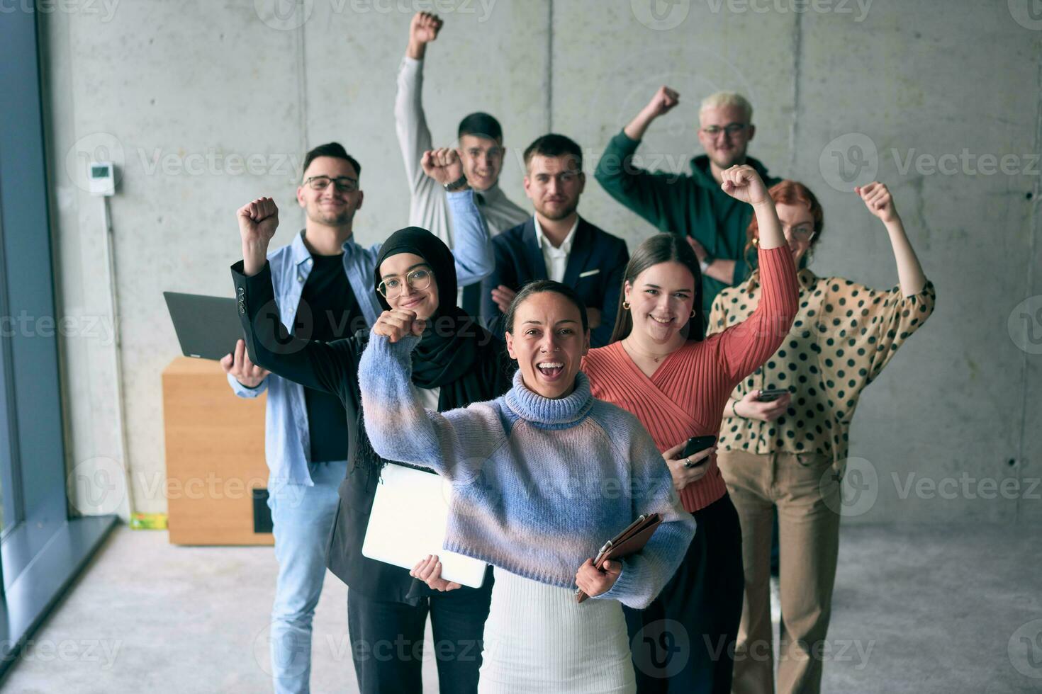 A diverse group of successful businessmen raises their hands in the air, symbolizing achievement, accomplishment, and the fulfillment of goals, exuding confidence, unity, and celebration of their collective success. photo