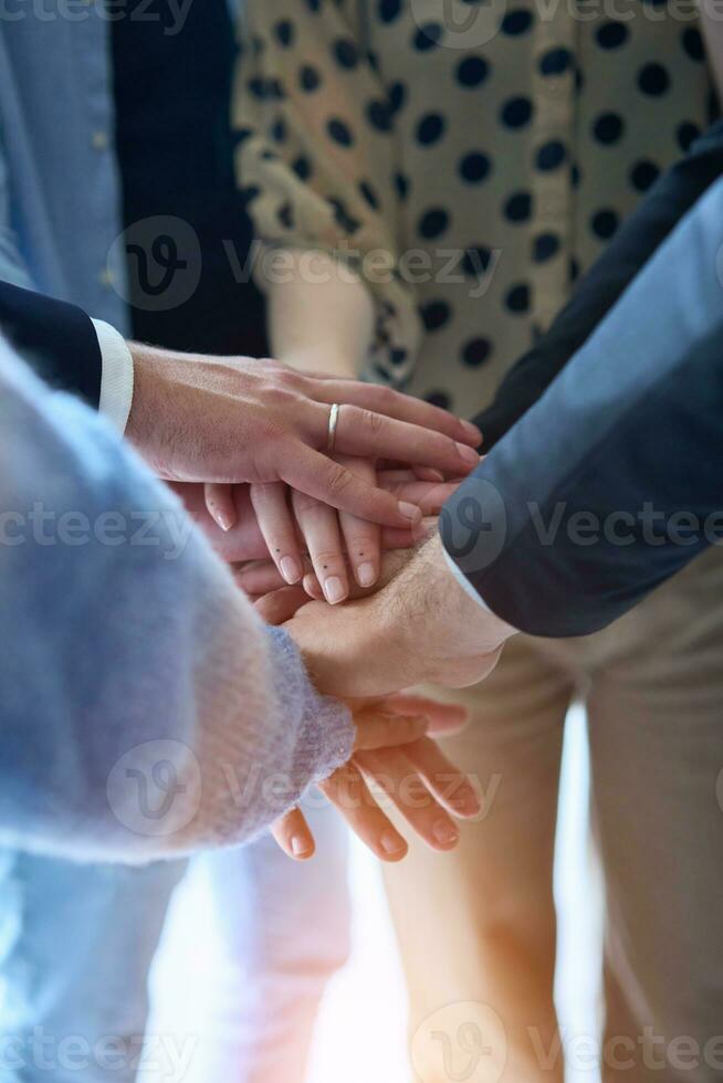 A top view photo of group of businessmen holding hands together to symbolize unity and strength