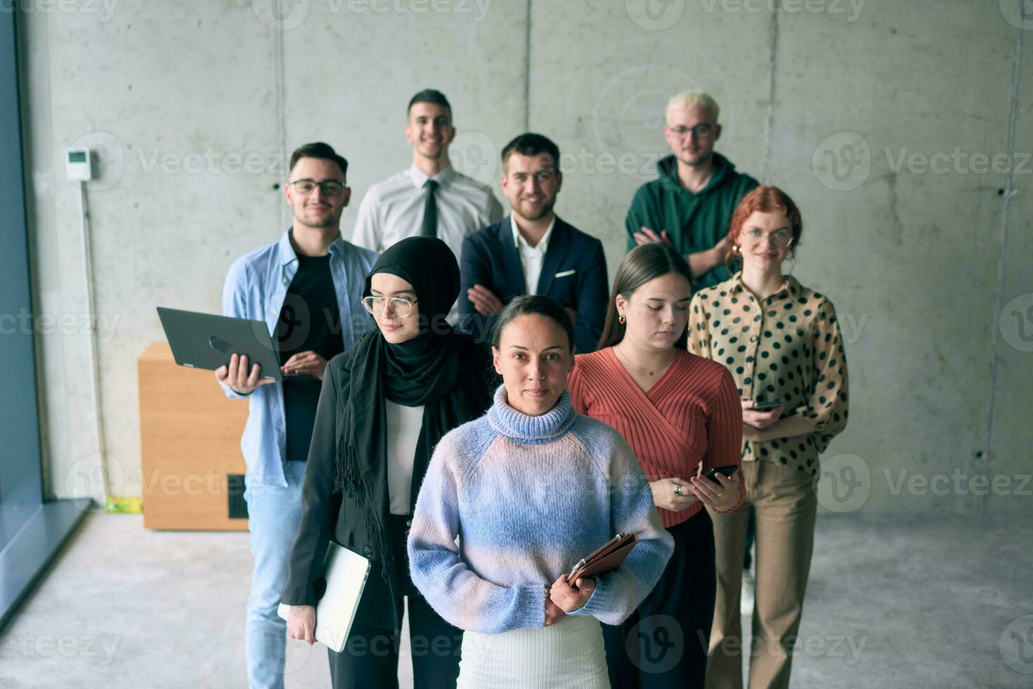 A diverse group of entrepreneurs in a modern office symbolizes a strong team of businessmen, showcasing their collaborative spirit, innovative mindset, and determination to achieve success in the competitive business world. photo