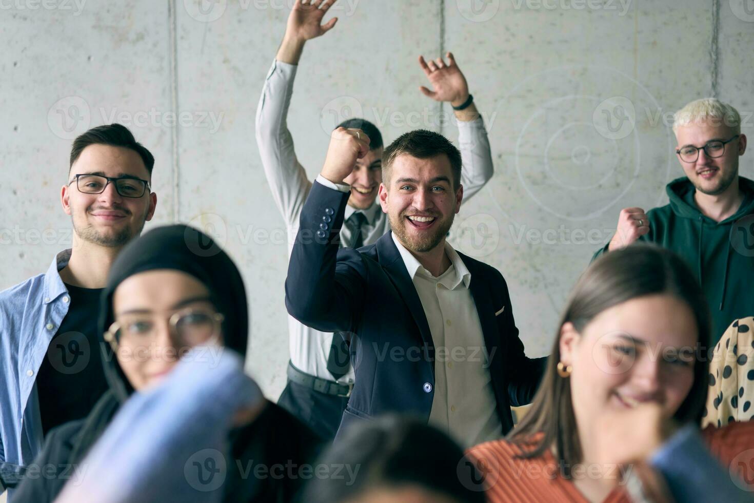 A diverse group of successful businessmen raises their hands in the air, symbolizing achievement, accomplishment, and the fulfillment of goals, exuding confidence, unity, and celebration of their collective success. photo