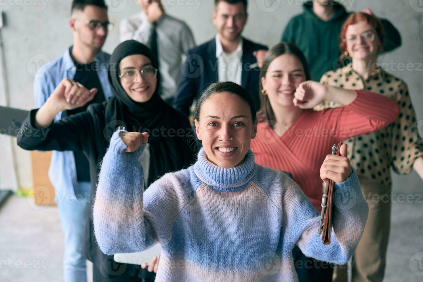 A diverse group of successful businessmen raises their hands in the air, symbolizing achievement, accomplishment, and the fulfillment of goals, exuding confidence, unity, and celebration of their collective success. photo