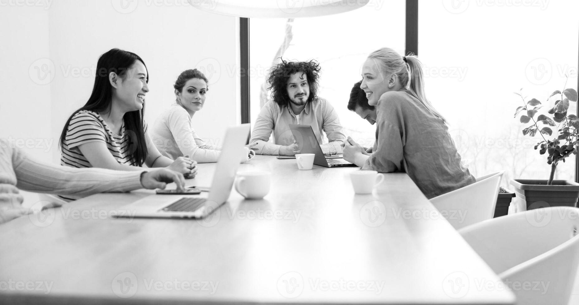 Startup Business Team At A Meeting at modern office building photo