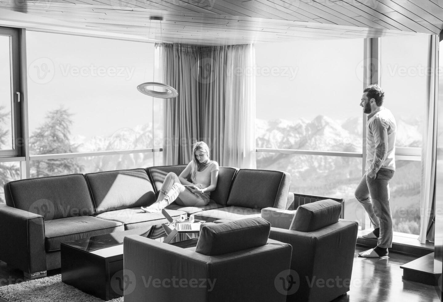 couple relaxing at  home using tablet computer photo