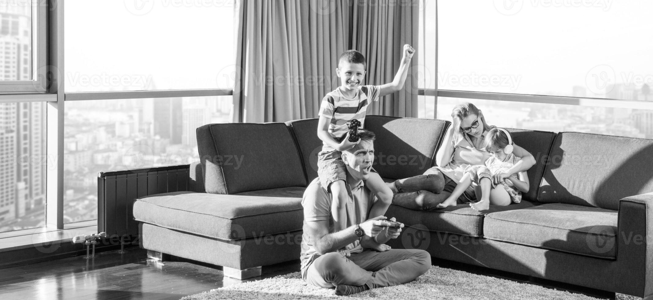 Happy family playing a video game photo