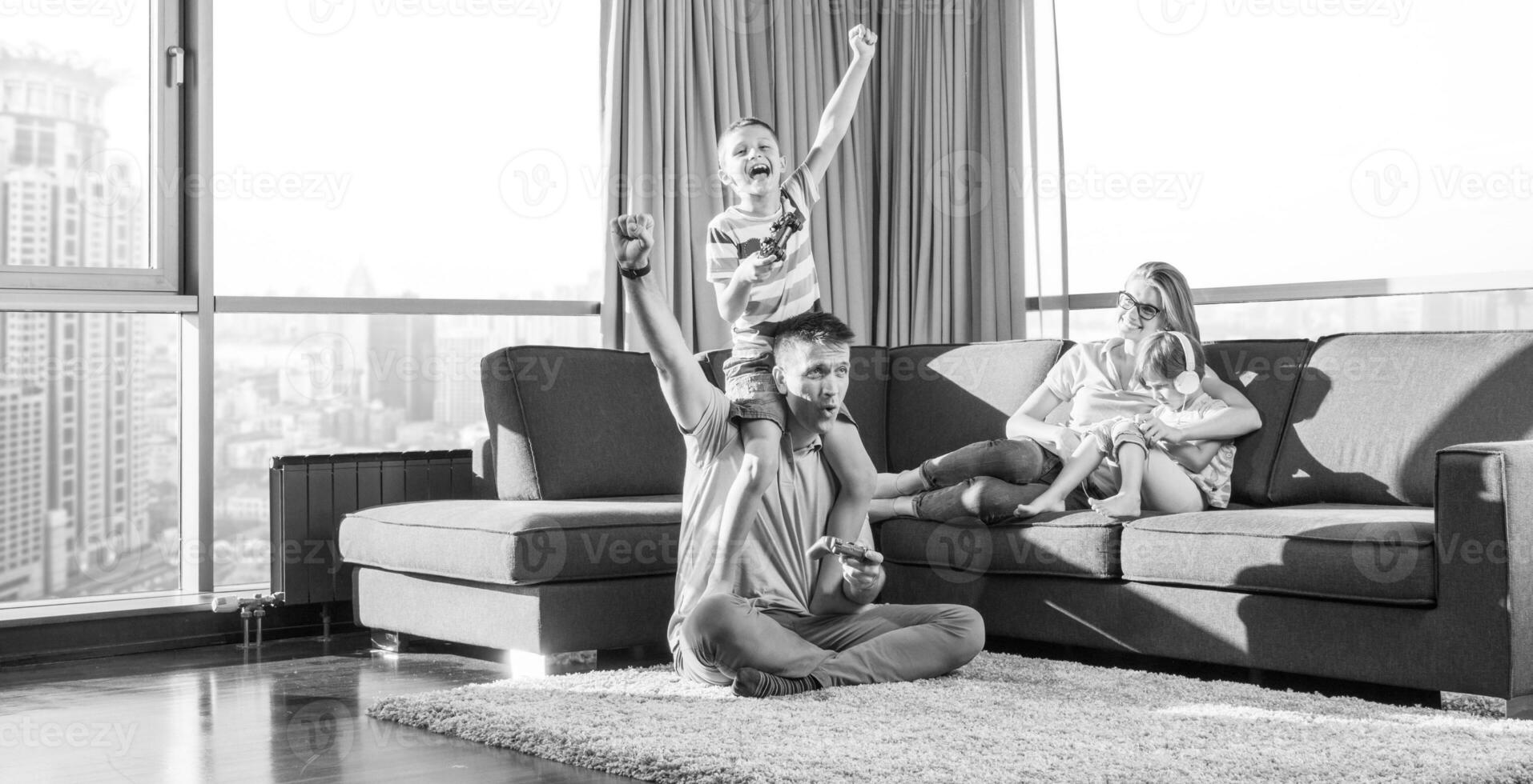 Happy family playing a video game photo