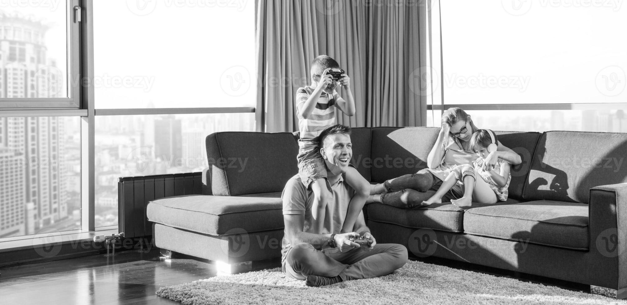 Happy family playing a video game photo