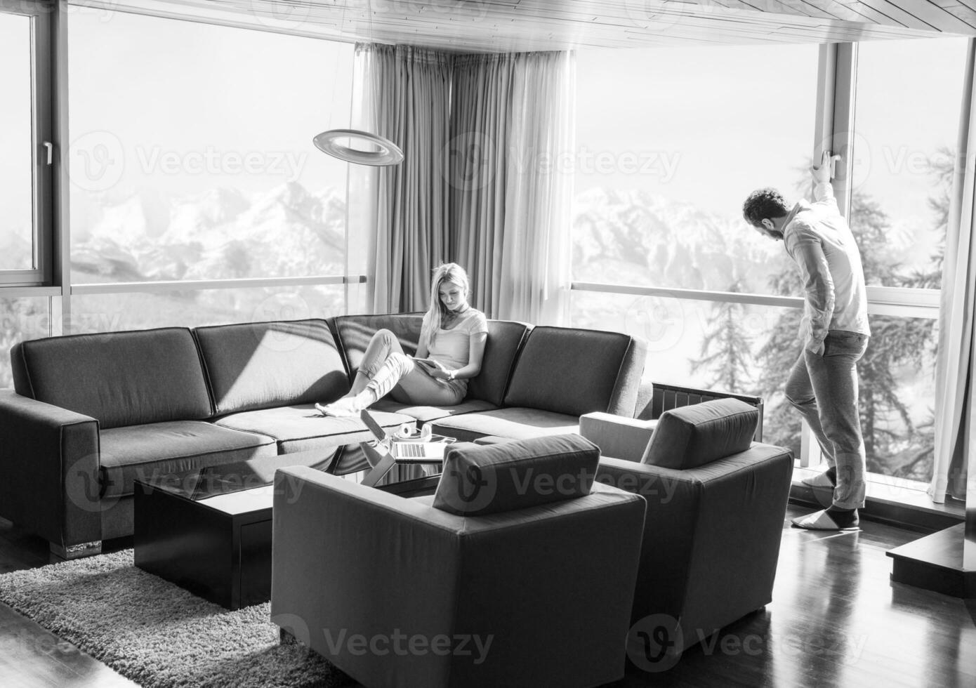 couple relaxing at  home using tablet computer photo