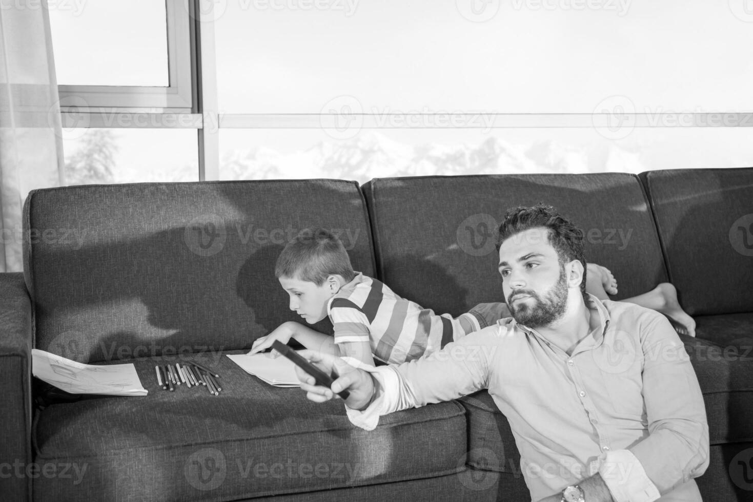 Happy Young Family Playing Together on sofa photo