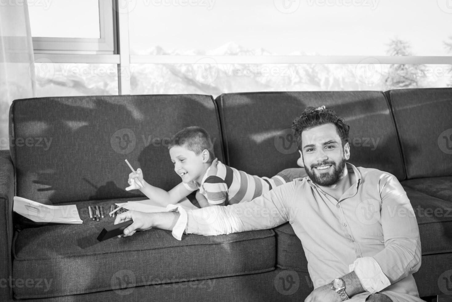 Happy Young Family Playing Together on sofa photo