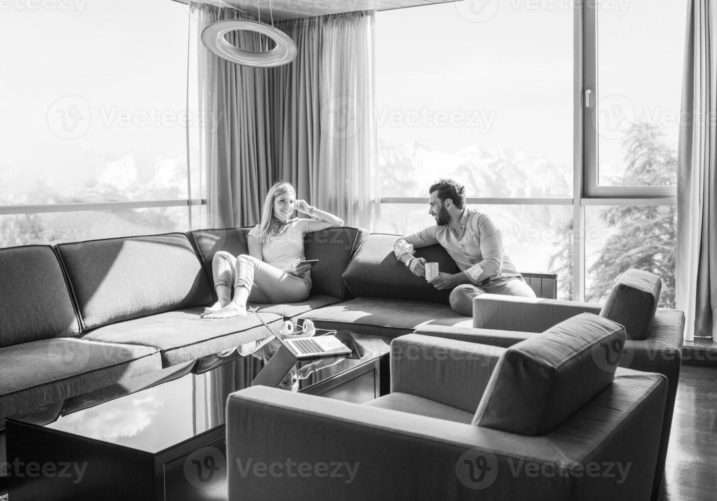 couple relaxing at  home using tablet computer photo