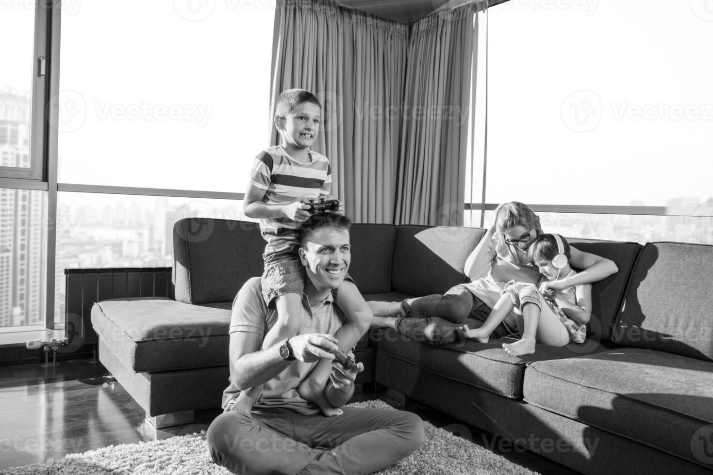 Happy family playing a video game photo