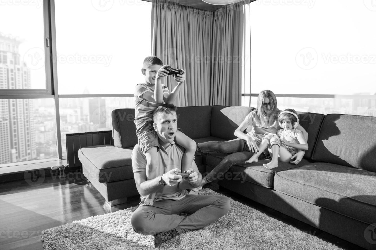 Happy family playing a video game photo