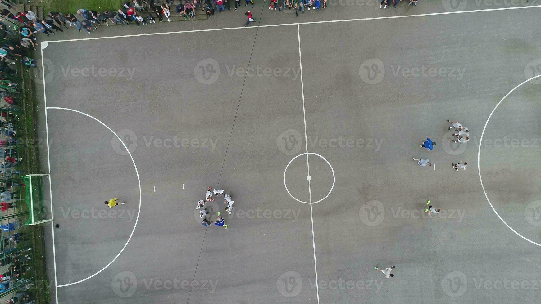 top view drone flying above amateur soccer game match. Countryside authentic tournament. photo