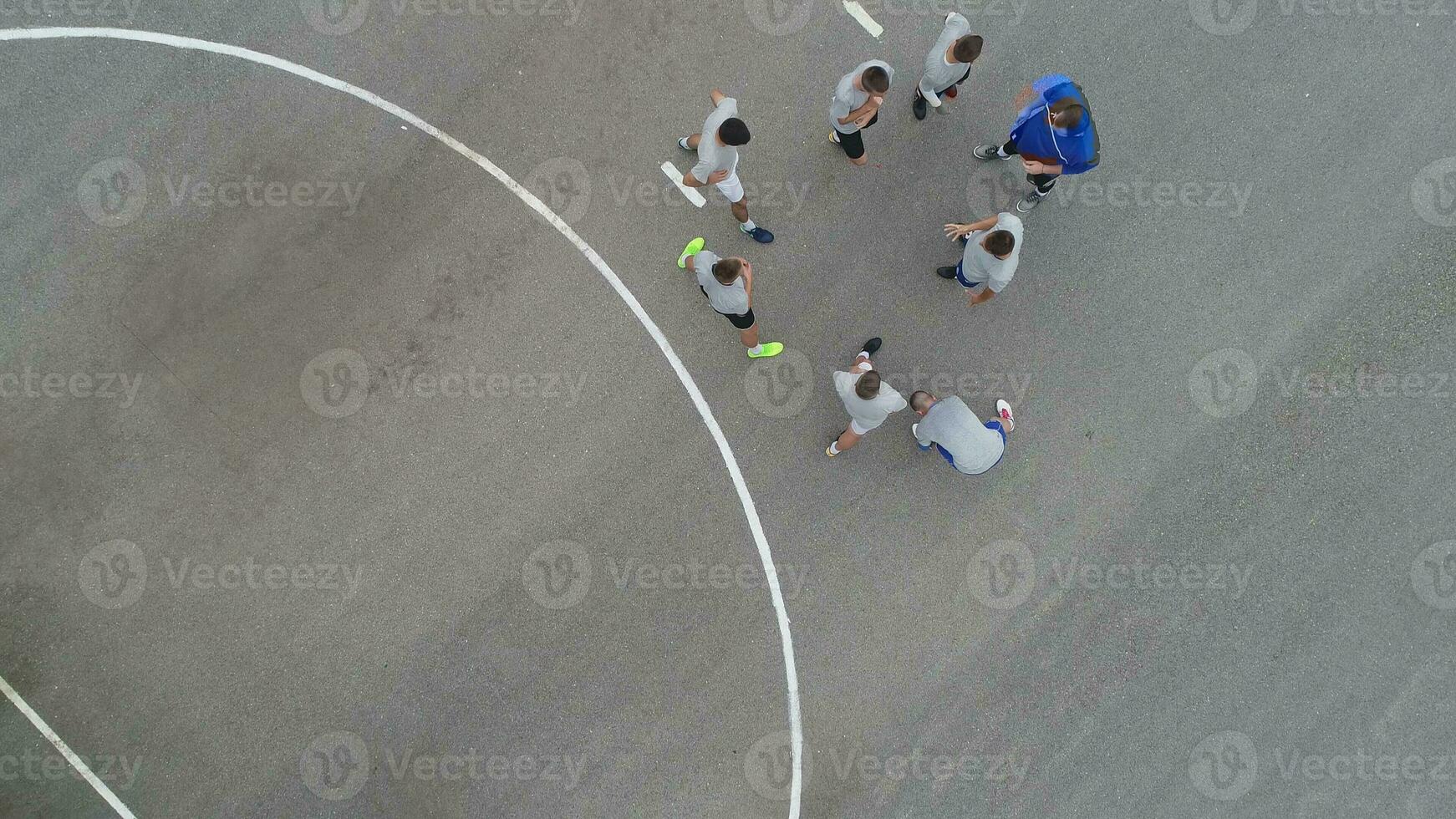 top view drone flying above amateur soccer game match. Countryside authentic tournament. photo