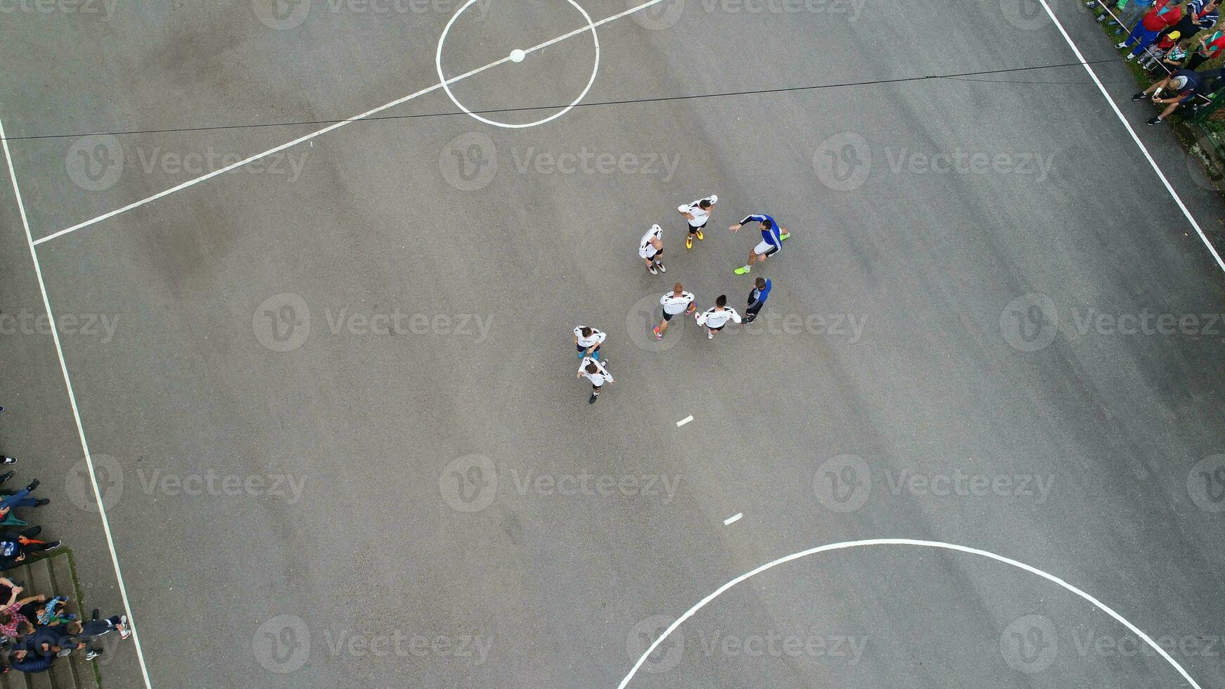 top view drone flying above amateur soccer game match. Countryside authentic tournament. photo