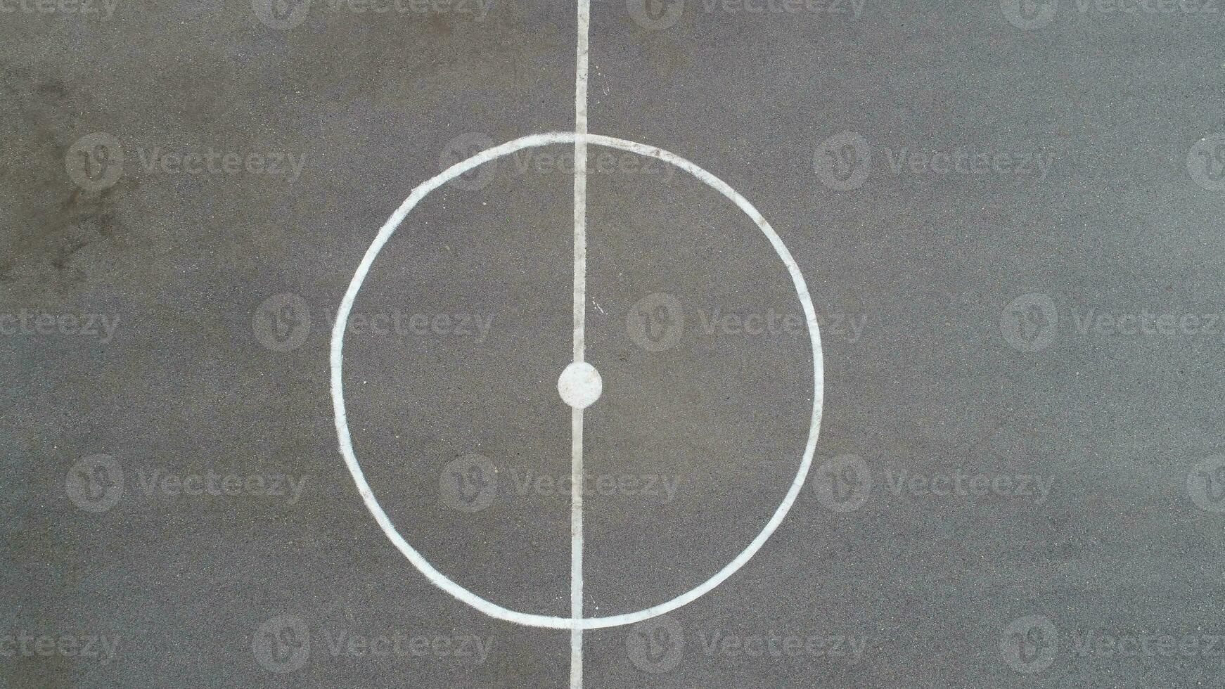 top view drone flying above amateur soccer game match. Countryside authentic tournament. photo